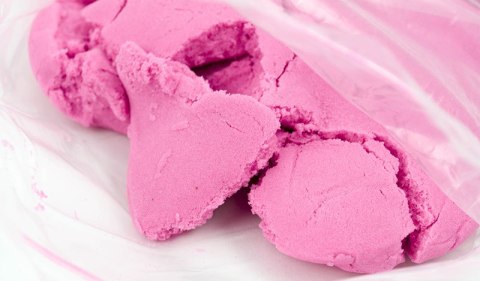 Piasek sensoryczny dla dzieci 1kg w woreczku pomarańczowy